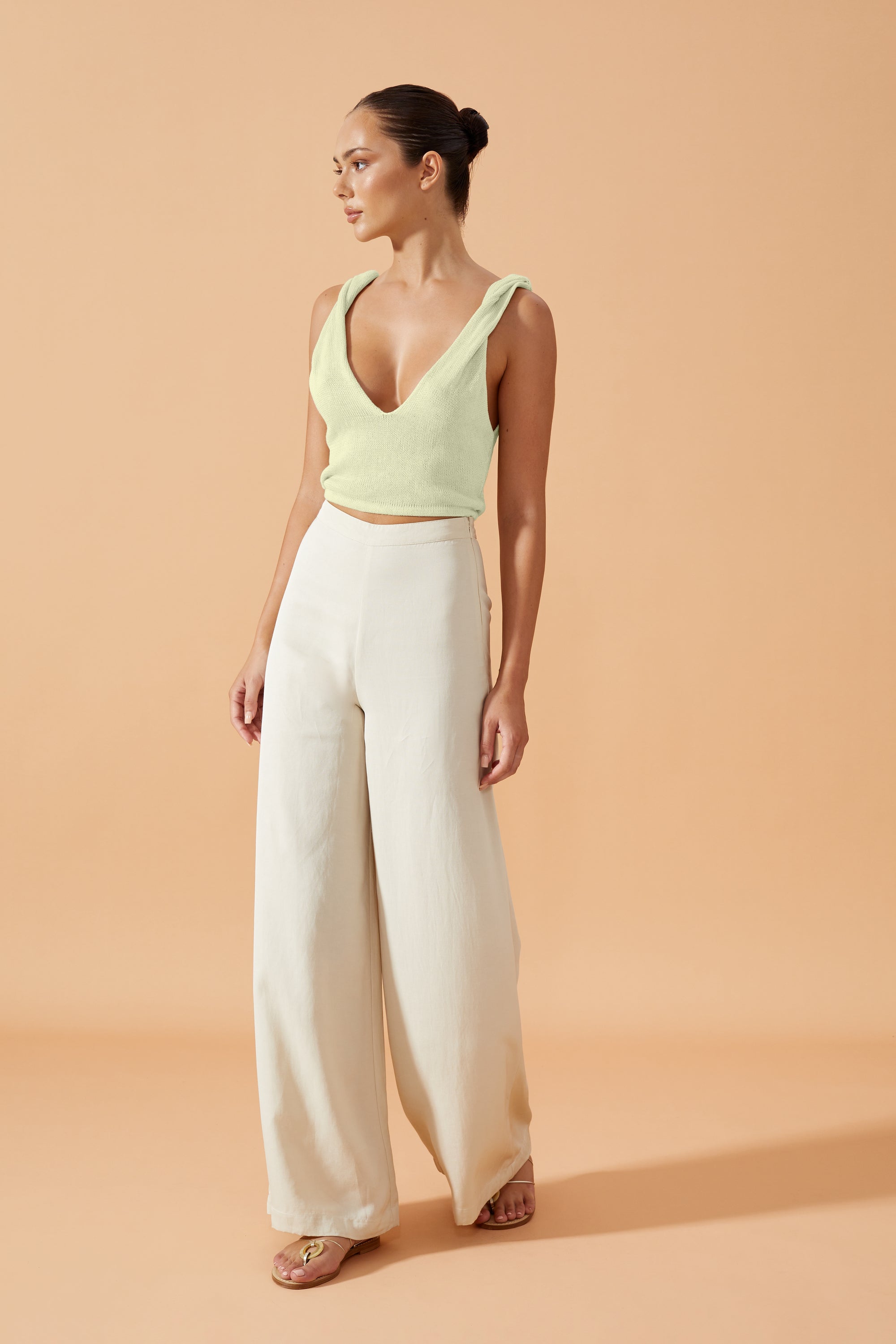 Flook The Label  Femi Knitted Top in Pistachio with  a  deep V neck back and front and twisted details on the shoulders, front view
