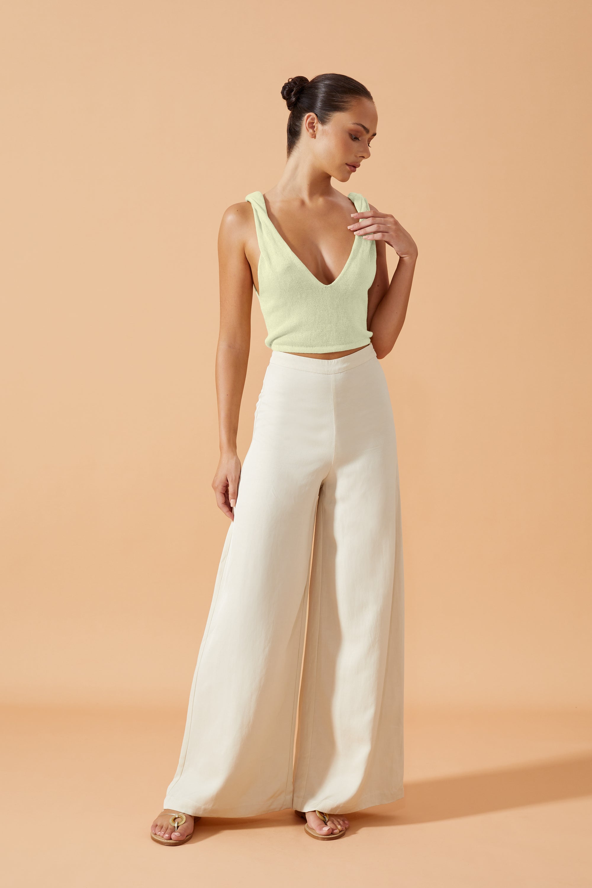 Flook The Label  Femi Knitted Top in Pistachio with  a  deep V neck back and front and twisted details on the shoulders, front view