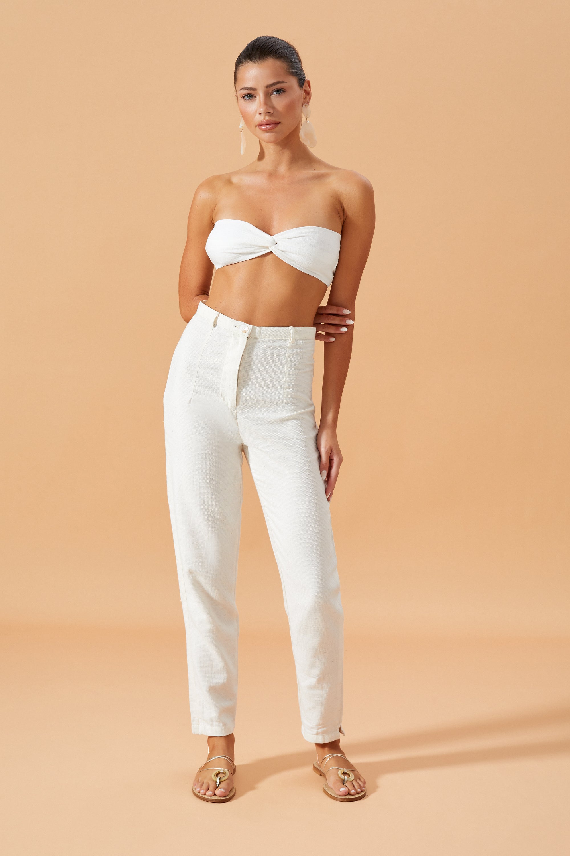 The Shania bralette Top in Off White featuring a centre knot design, styled with Vietta Pants