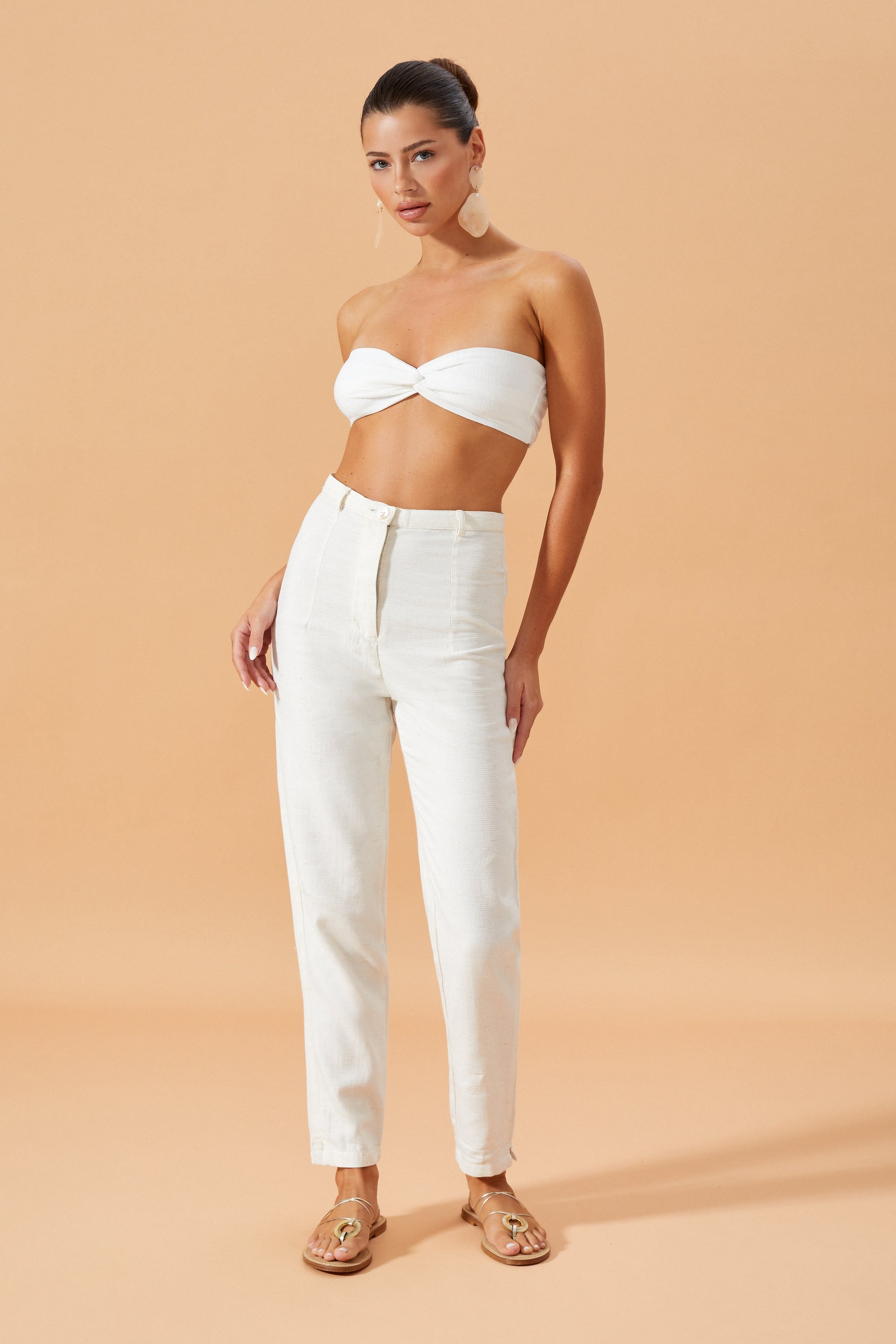 The Shania bralette Top in Off White featuring a centre knot design, styled with Vietta Pants