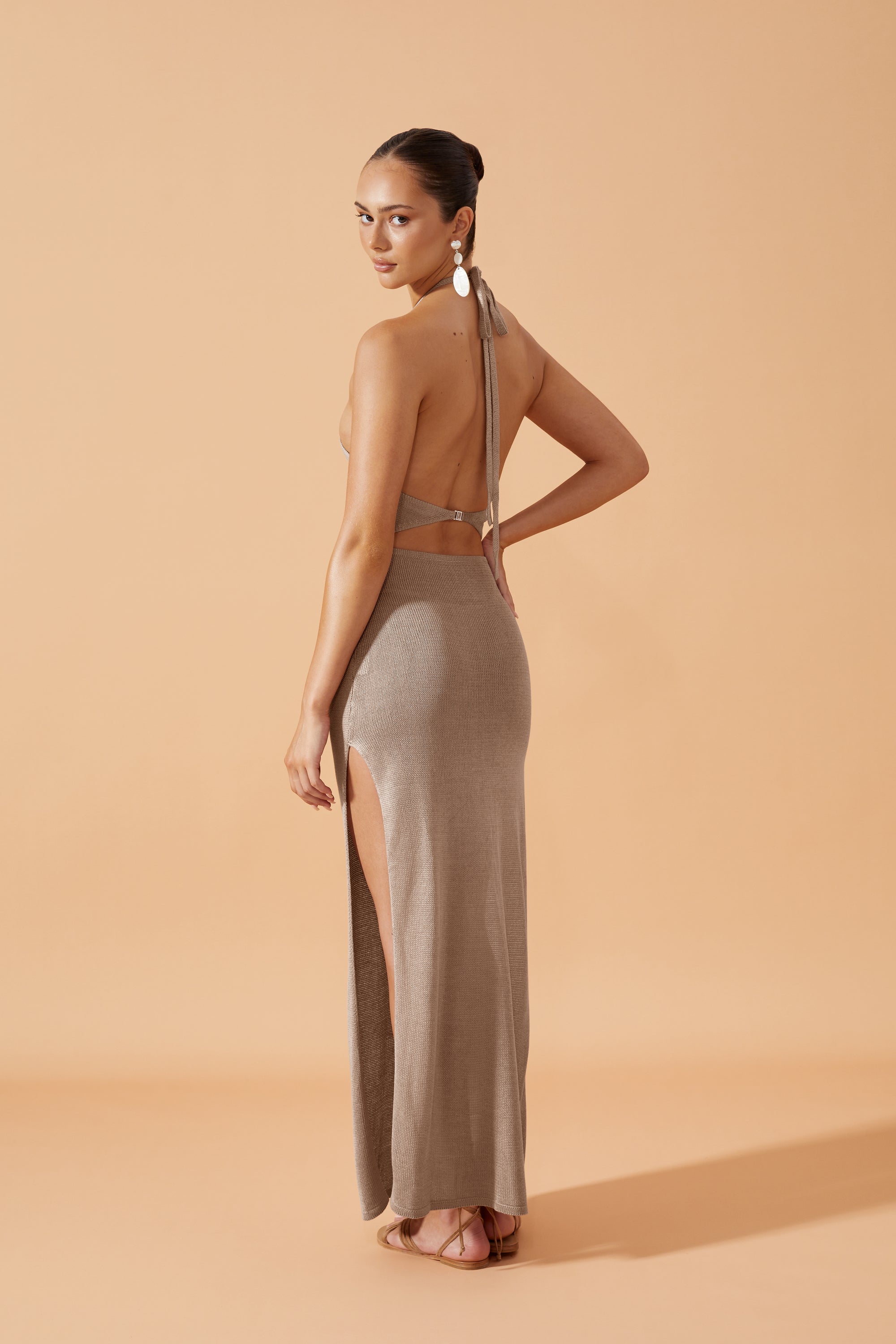 Flook The Label Lua Knit Long Dress in Taupe. Open front crossed at the neck and  closed with a clasp. Splits on both sides. Back View