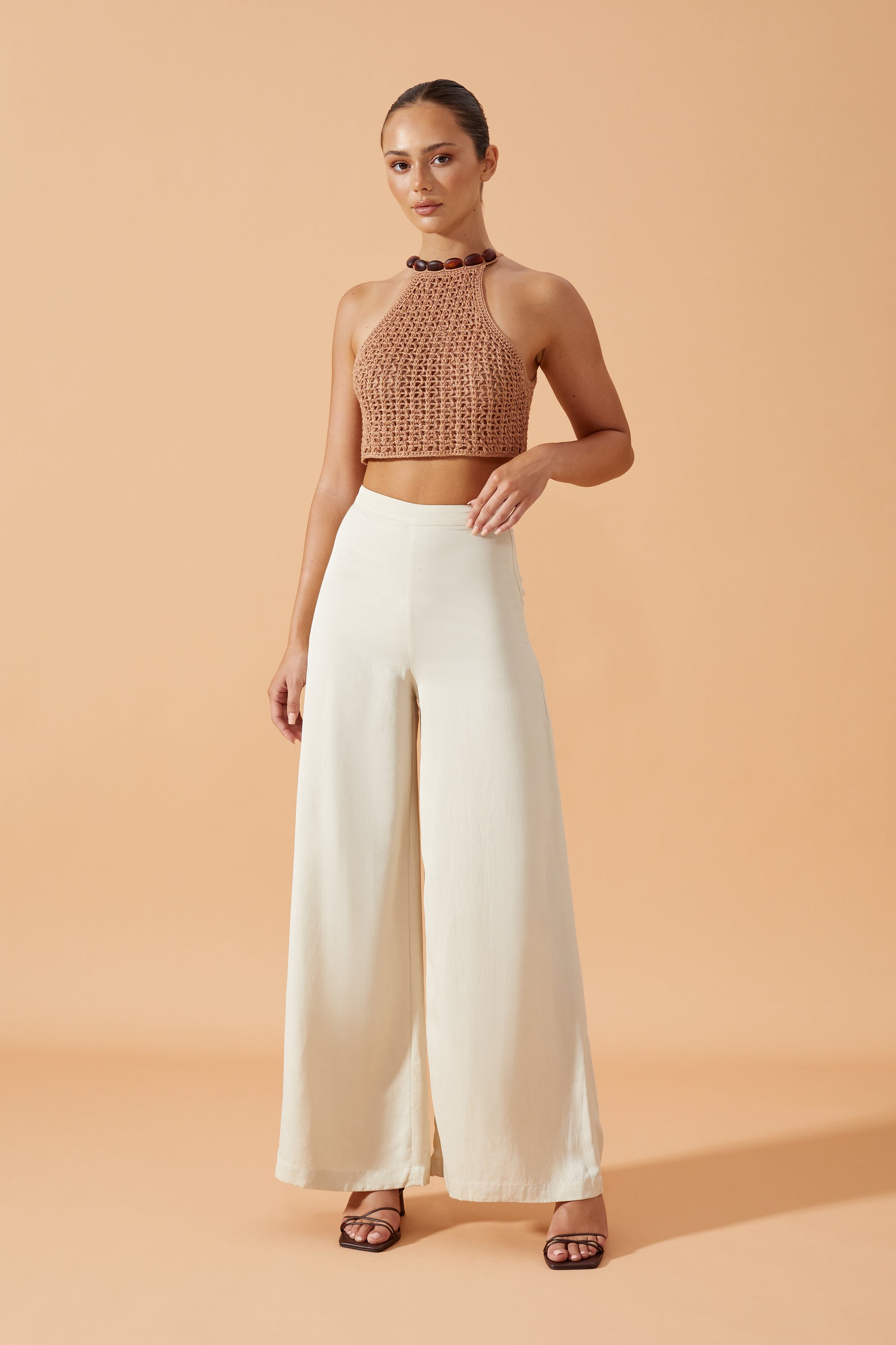 Flook The Label Zarela Wide Legs Pants in White. Matched with Sonali Crochet Top in Terracotta. Front View 