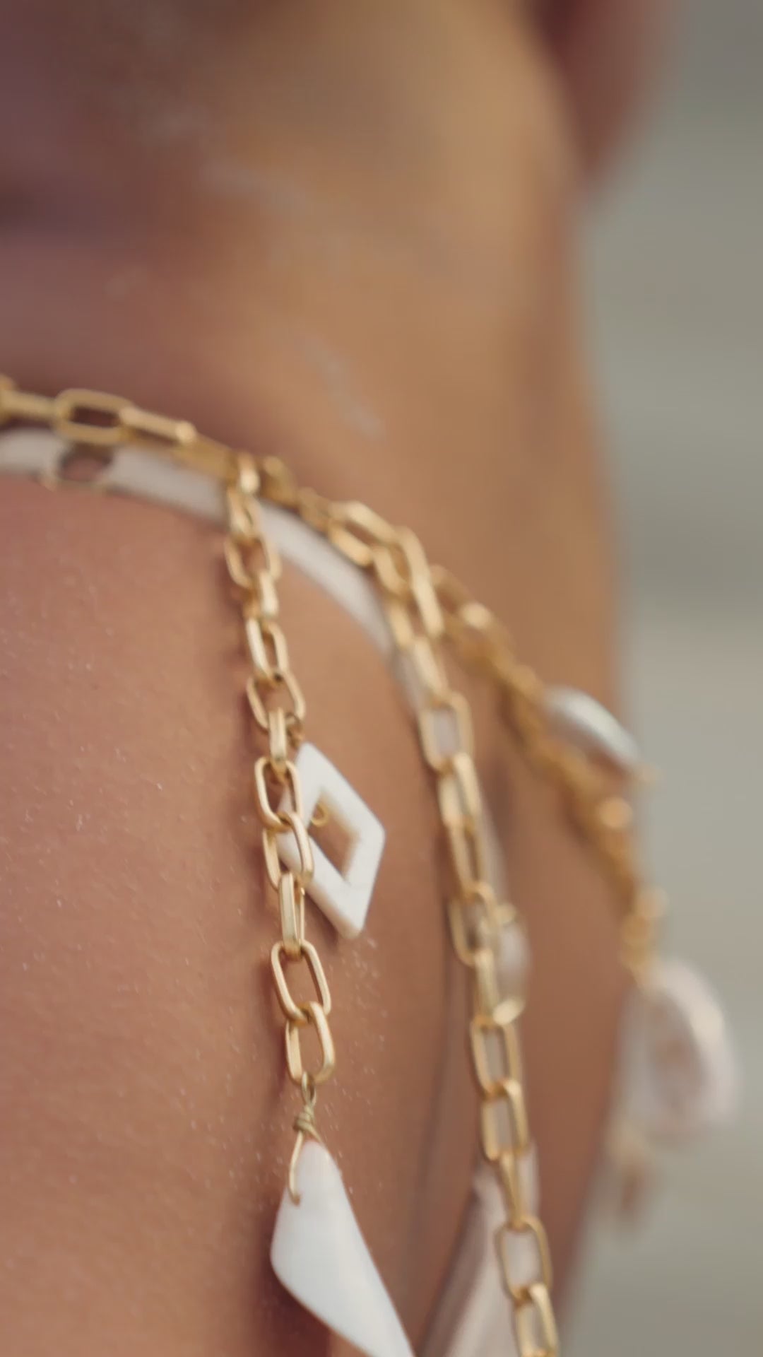 flook the label olamii jewelry collab ophira belt gold shells pearls swimwear model 